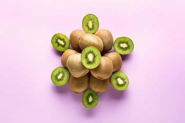 Composition with tasty ripe kiwi on color background