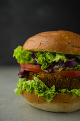 Vegan burger with lettuce and tomato