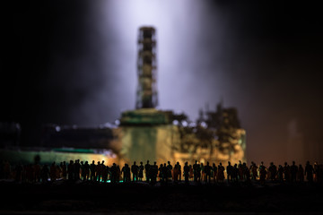 Obraz premium Creative artwork decoration. Chernobyl nuclear power plant at night. Layout of abandoned Chernobyl station after nuclear reactor explosion.