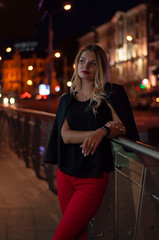 Art portrait of a beautiful girl. gorgeous blonde girl, portrait in night city lights.