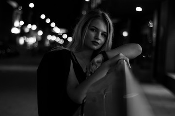 Art portrait of a beautiful girl. gorgeous blonde girl, portrait in night city lights.