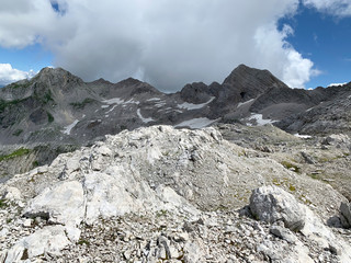 Tourists in the mountains of Abkhazia in summer in sunny day