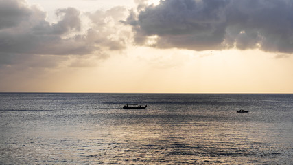 Fototapeta premium A traditional small fishing boat sailing in the ocean
