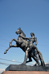 Fototapeta premium Horse tamers monument on Anichkov Bridge in Saint-Petersburg Russia. Popular touristic landmark.