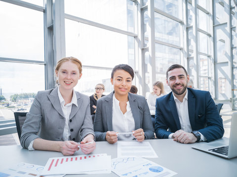 Three Smiling Business People