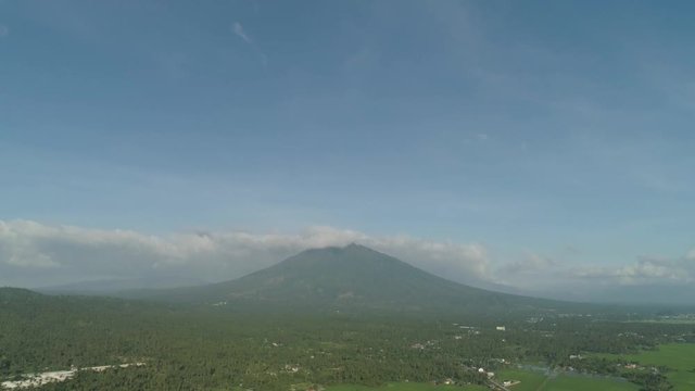 Aerial view mountain valley with hills covered forest, trees, mount Iriga. Luzon, Philippines. Slopes of mountains with evergreen vegetation. Mountainous tropical landscape.