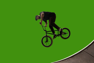 BMX rider on green screen.