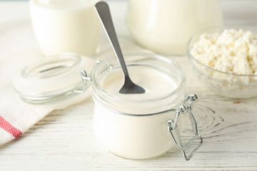 Different dairy products on white wooden background, close upDifferent dairy products on white wooden background, close up