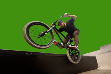 BMX rider on green screen.