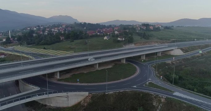 Aerial view of highway and overpass in city. Aerial view roundabout interchange of a city. Expressway is an important infrastructure.