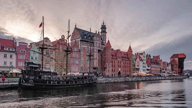 Day to night time lapse of the Gdansk old town and famous crane at sunset