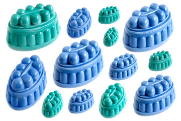 A collection of Dutch pudding moulds on a white background
