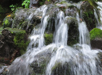 Fototapeta na wymiar Steaming water at a cascade in Shirakawa fountainhead