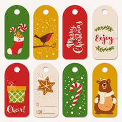 Tags and labels for Christmas holidays with symbols and lettering.