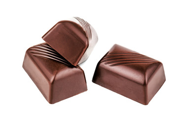 three chocolate candy on white