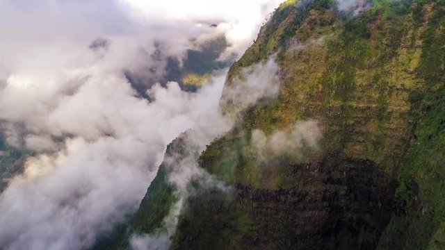 Aerial shot of the cliff mountain and the sea in Na Pali coast in Kauai Hawaii