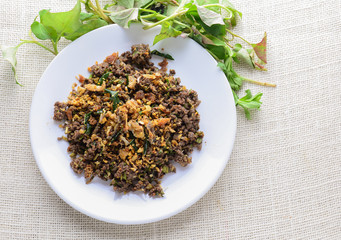 Fototapeta na wymiar Minced fish Spicy Salad with Herbs, It is also eaten in the North and Northeast regions, an area of Thailand where the majority of the population is of the Lao ethnicity.