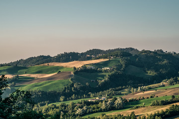 Cultivated hills in the Northern Apennines at summer. Loiano, Bologna province, Emilia Romagna, Italy.