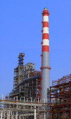 view of metal pipes of industrial plant outdoor at sunny day