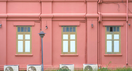 Fototapeta na wymiar Vintage green window frames on red walls