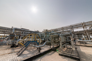 Fototapeta premium low angle view of metal pipes of industrial plant outdoor 