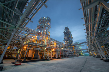 view of metal pipes of industrial plant outdoor at night  - Powered by Adobe