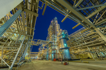 view of metal pipes of industrial plant outdoor at night 