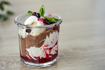 dessert with chocolate and berries in the glass