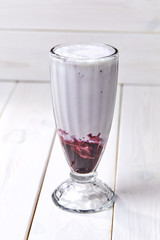 berry smoothie on the wooden background