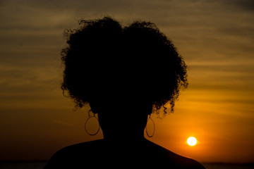 silhouette of a woman in the sunset