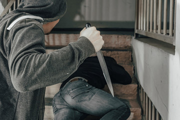 A man with a knife is trying to kill a man on the landing. topics of violence and murder. thief,...