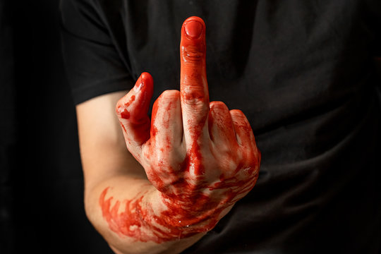 Male hands showing various gestures in the blood on a black background. fuck off, middle finger up