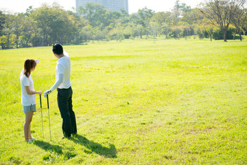 Fototapeta na wymiar Trainer golf tutor practice for new golf player.