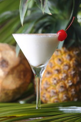 The Pina Colada is a sweet cocktail made with rum, coconut cream or coconut milk, and pineapple juice. It may be garnished with either a pineapple wedge, maraschino cherry, or both.