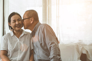 Asian senior couple at home.