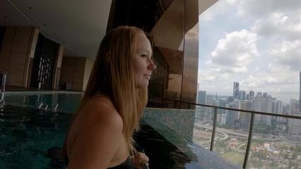 Slowmotion shot of a young woman doing exercises on an underwater aqua treadmill. Aqua sport exercises concept.