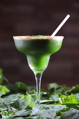 Chaya or tree spinach cocktail with pepper decorated with leaves.