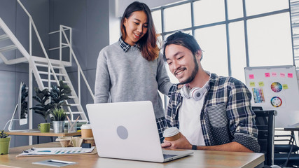 woman designer buy coffee cup to colleague at modern office in morning at desk.casual workplace lifestyle.
