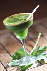 Chaya or tree spinach cocktail with pepper decorated with leaves.