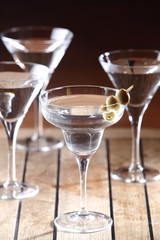 The martini is a cocktail made with gin and vermouth, and garnished with an olive or a lemon twist. Over the years, the martini has become one of the best-known mixed alcoholic beverages.
