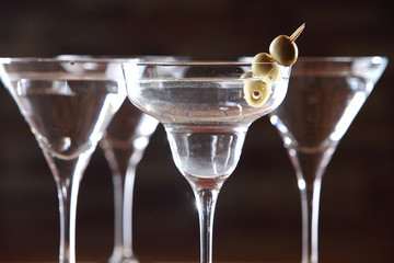 The martini is a cocktail made with gin and vermouth, and garnished with an olive or a lemon twist. Over the years, the martini has become one of the best-known mixed alcoholic beverages.