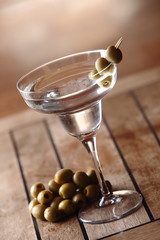 The martini is a cocktail made with gin and vermouth, and garnished with an olive or a lemon twist. Over the years, the martini has become one of the best-known mixed alcoholic beverages.