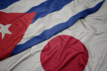 waving colorful flag of japan and national flag of cuba.