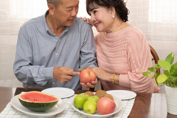 Asian senior couple at home.