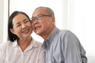 Asian senior couple at home.