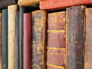 Very old books. Torn cover of an old book. Historical books and publications