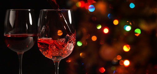 Beautiful splash of red wine in a glass