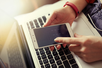 Woman hands holding smartphone.