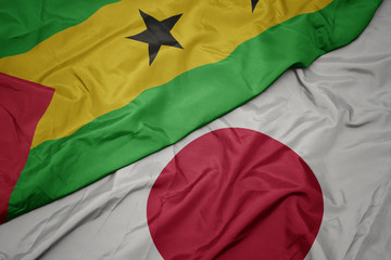 waving colorful flag of japan and national flag of sao tome and principe.