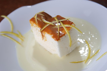 Lemon pie dessert with cajeta and lemon zest sauce.